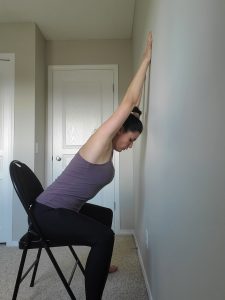 Seated shoulder stretch to wall