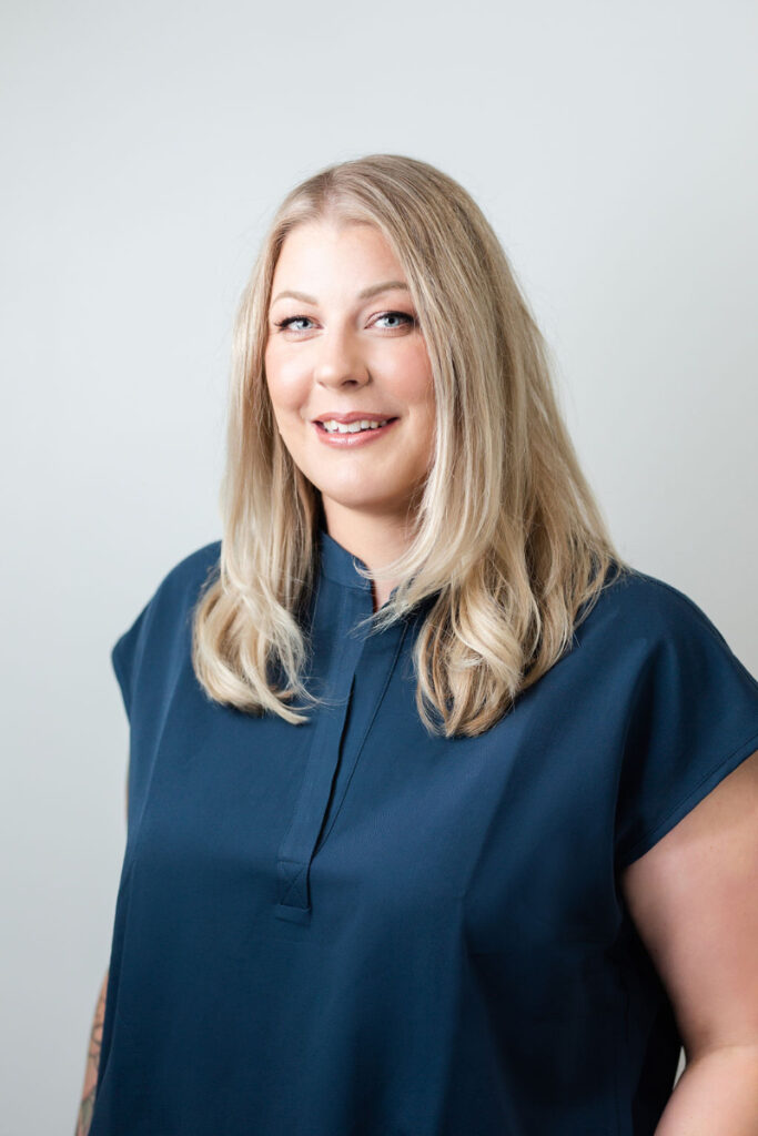 Acupuncturist portrait in clinic setting specializing in acupuncture for endometriosis and women’s health care